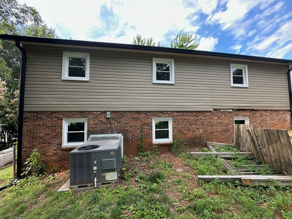 Gallery photos for Wood Windows Swapped for Low-Maintenance Vinyl on This Split-Level Home: Image #1